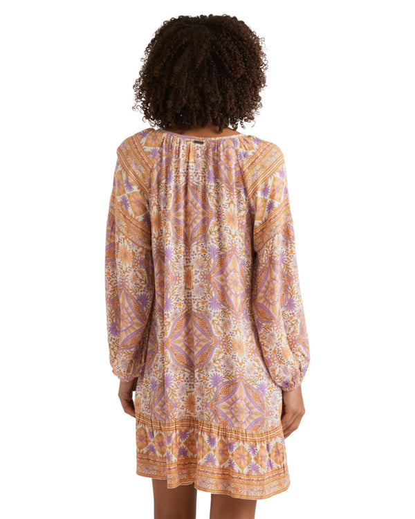 Back view of the long-sleeve mini dress showing gathered detail and relaxed fit.