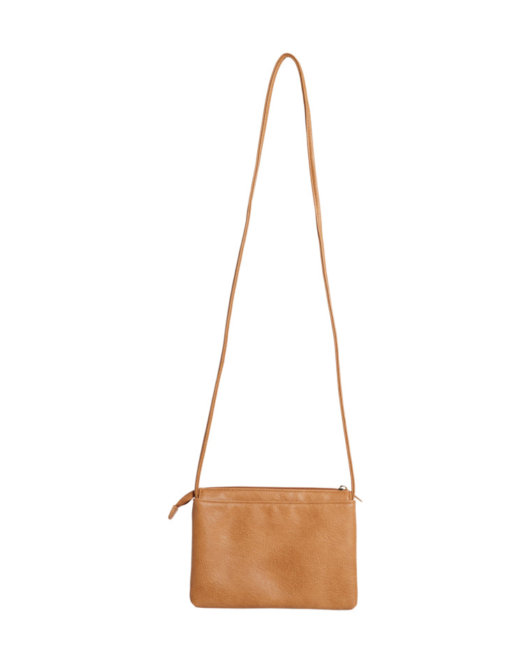 Back view of plain tan Billabong crossbody bag with smooth texture.