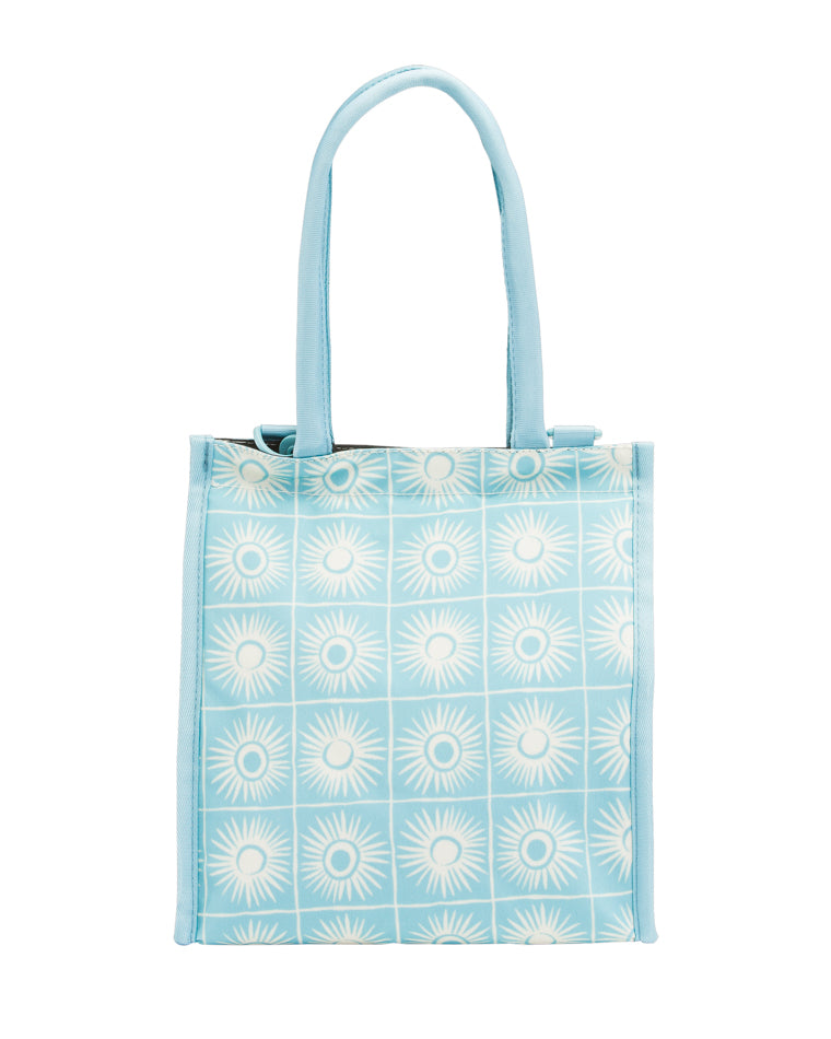 Back view of light blue Billabong tote with white sunburst pattern and two short handles.