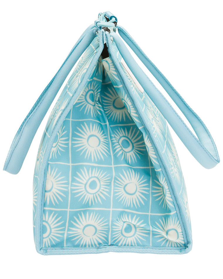 Side view of structured blue Billabong bag showing interior and symmetrical sunburst design.