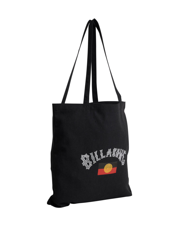 Side view of black tote bag showing white Billabong logo and yellow-red graphic