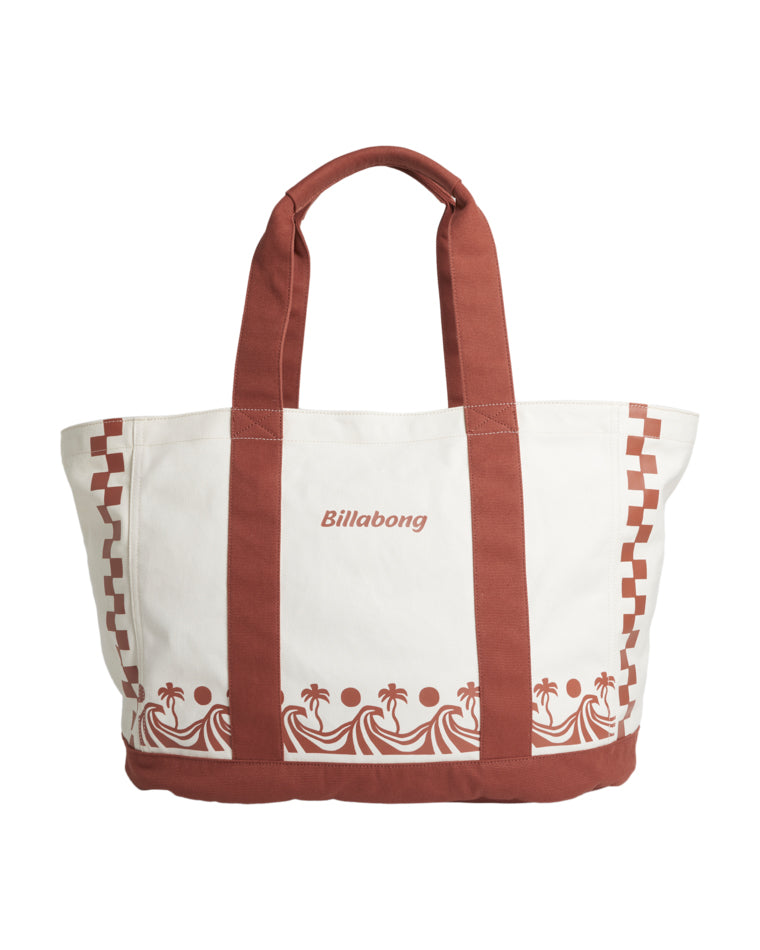 Cream canvas tote bag with rust handles, Billabong logo, wave and palm tree print at the base.