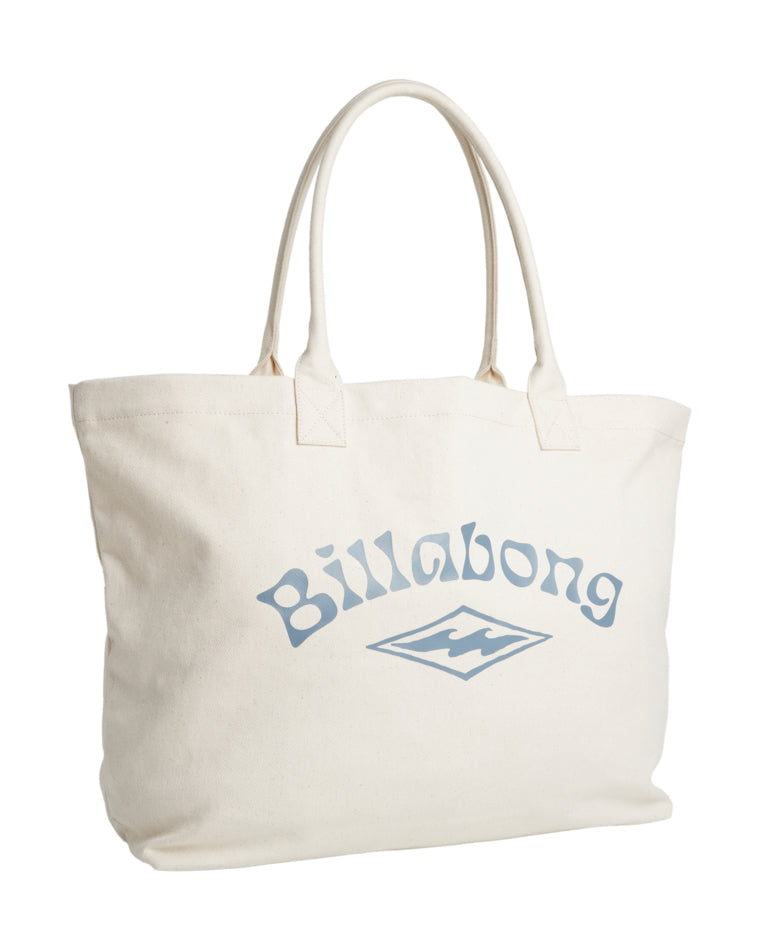 Angled view of Billabong cream tote bag showing front logo and double handles.
