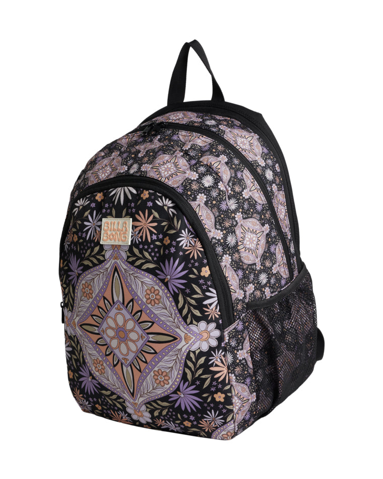 Side angle of patterned backpack showing main compartments and mesh pocket.