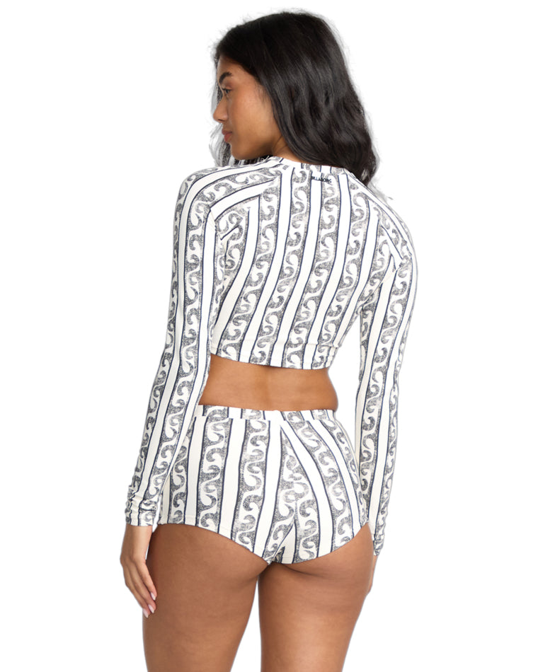 Back view of the black and white swirl stripe print crop top and matching high-waisted shorts.