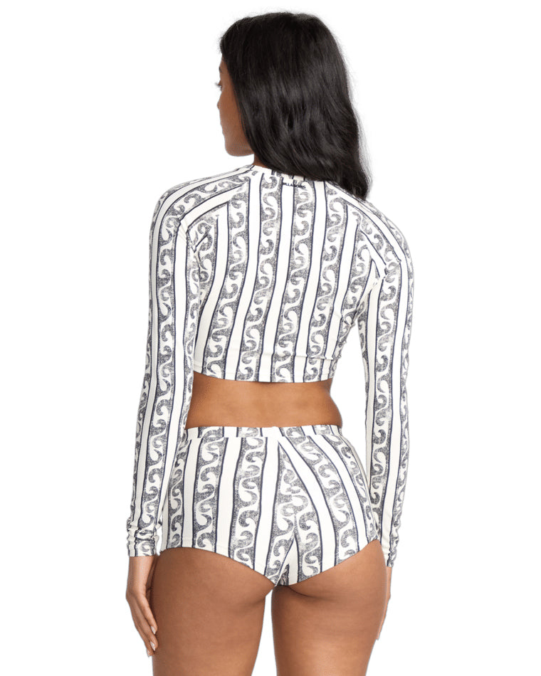 Back view of black and white striped crop rash vest and high-waisted swim bottoms.