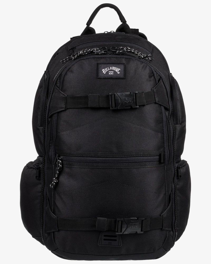 Front view of a black Billabong backpack with top handle, two buckles, and zippered compartments.