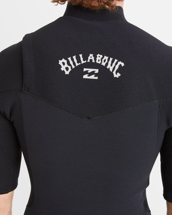 Back view of black Billabong wetsuit showing white Billabong logo.