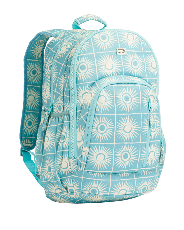Angled front view of a blue backpack with white sunburst pattern, featuring zippered compartments and a grab handle.