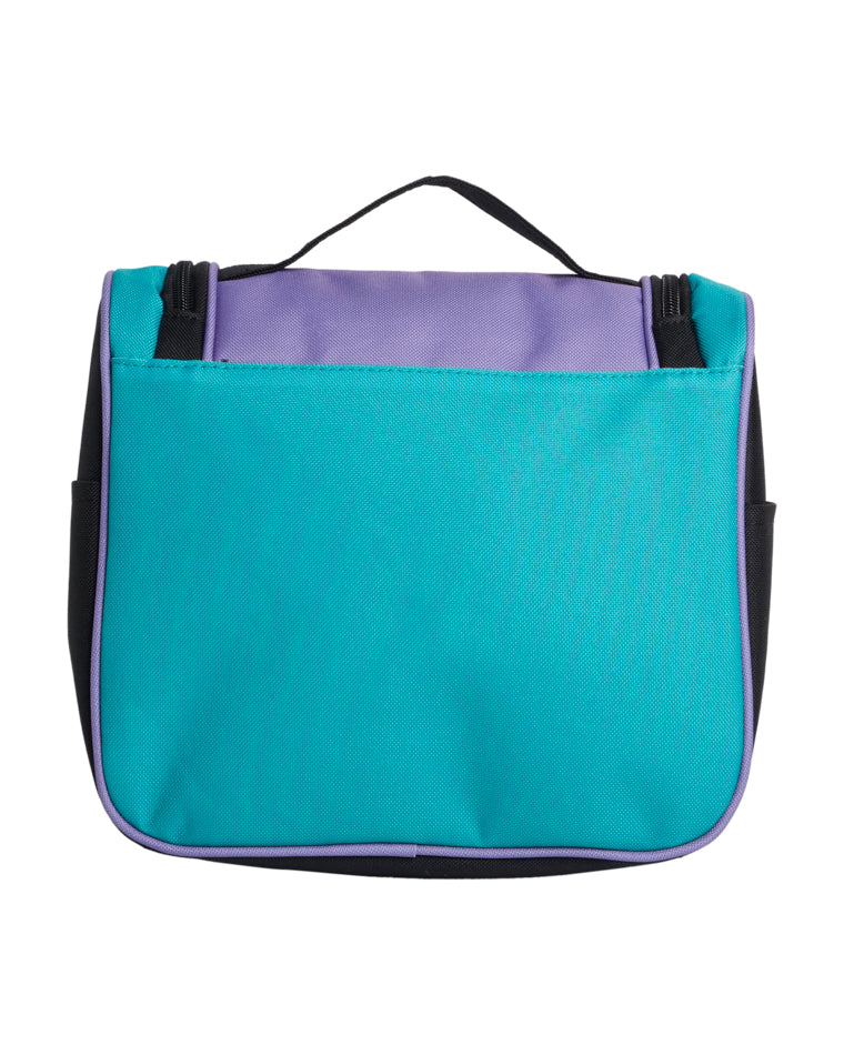 Back view of a Billabong travel bag with a teal body, purple top panel, black side panels, and a black carry handle.
