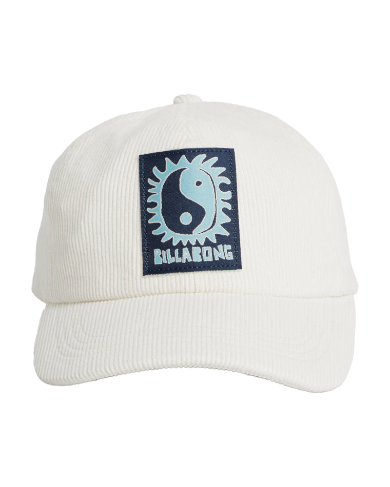 Cream corduroy cap with a navy and light blue sun yin-yang patch on the front and Billabong text logo beneath.