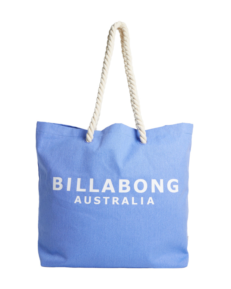 Front view of a light blue Billabong Australia tote bag with white rope handles and bold white branding across the front.
