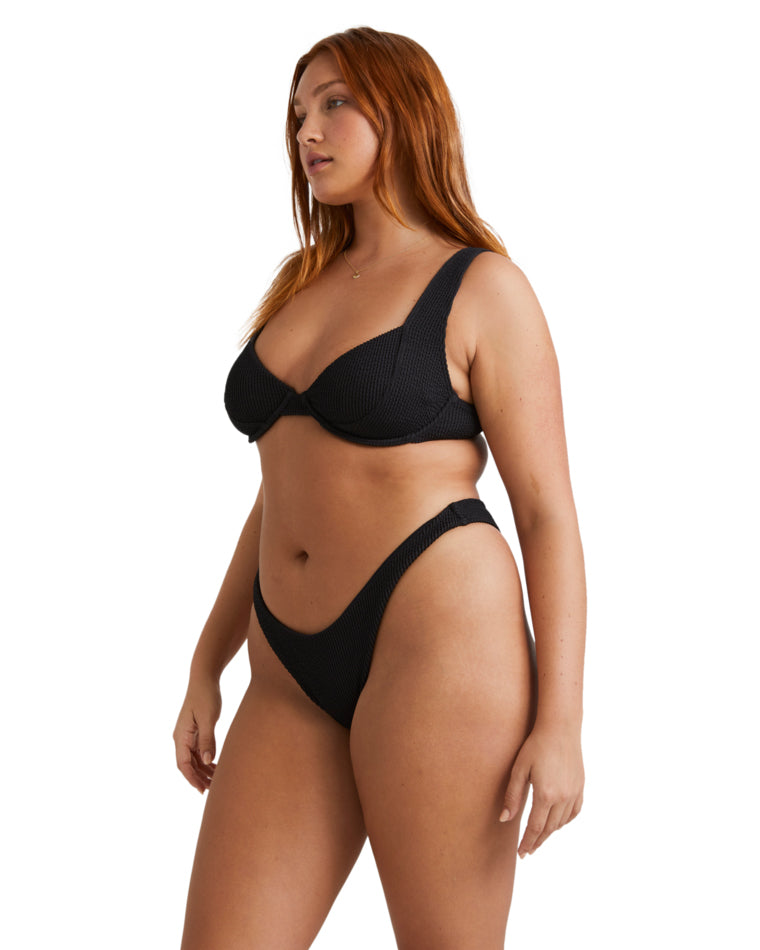 Side view of black bikini showing underwire support and high-cut bottoms.