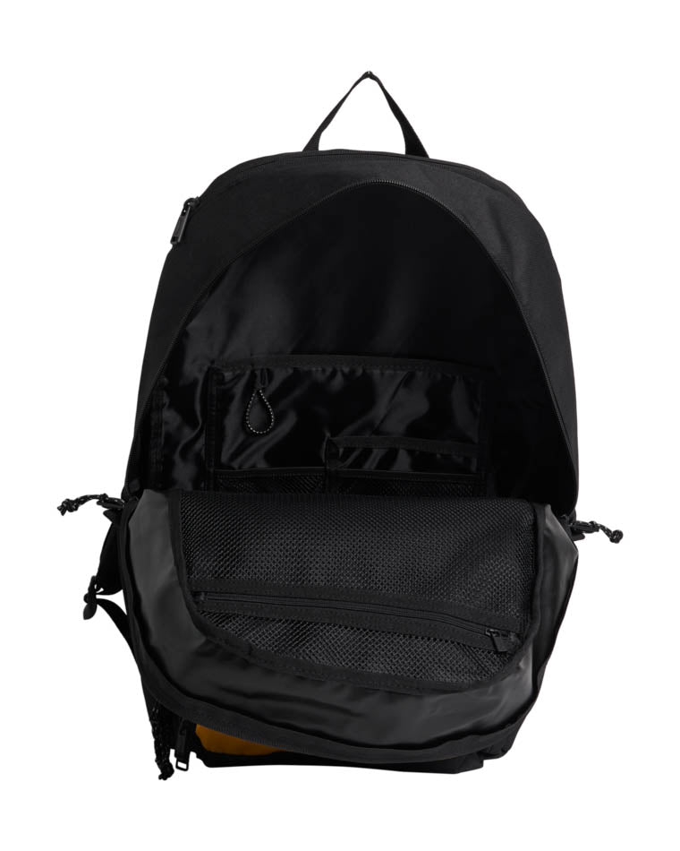 Interior view of a black Billabong backpack showcasing multiple compartments, mesh pockets, and an organized layout.