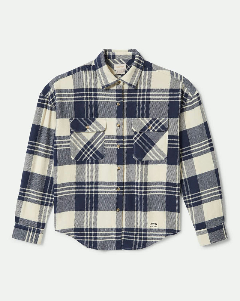 Blue and white plaid flannel shirt with button-up front, dual chest pockets, and a curved hem for a relaxed fit.