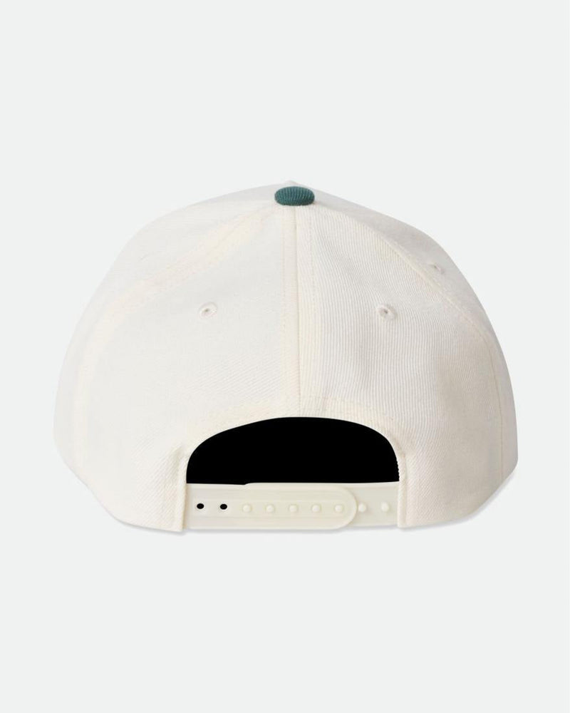 Back view of white snapback cap with adjustable cream strap and green button on top.