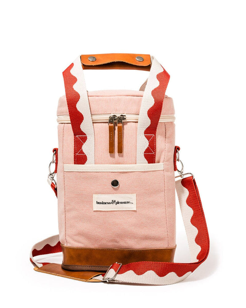 Stylish pink and brown wine cooler tote bag with leather accents, zip closure, and adjustable red wave-pattern strap.