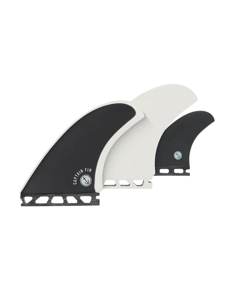 Three-piece Captain Fin Co fin set in black and white with dual tab base, designed for thruster setups.
