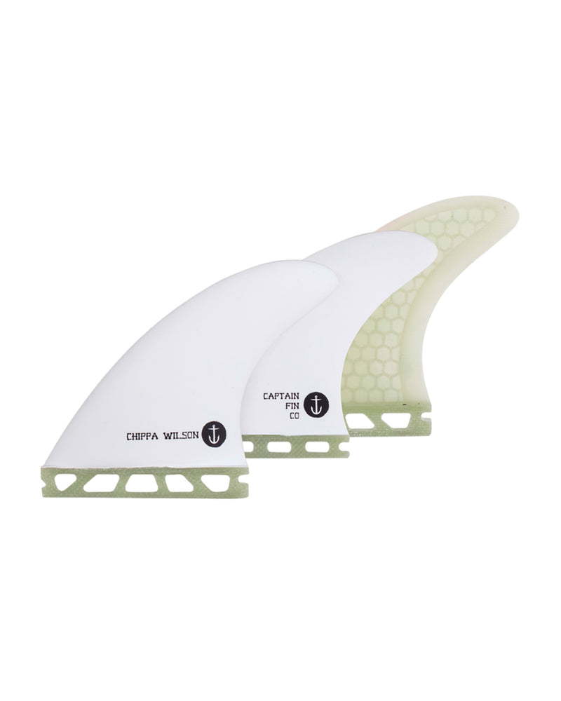 Captain Fin Chippa Wilson thruster fin set in white with green base and anchor logo