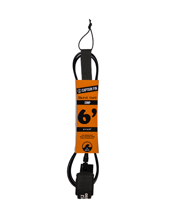 Surfboard leash with orange label and black cord on a white background