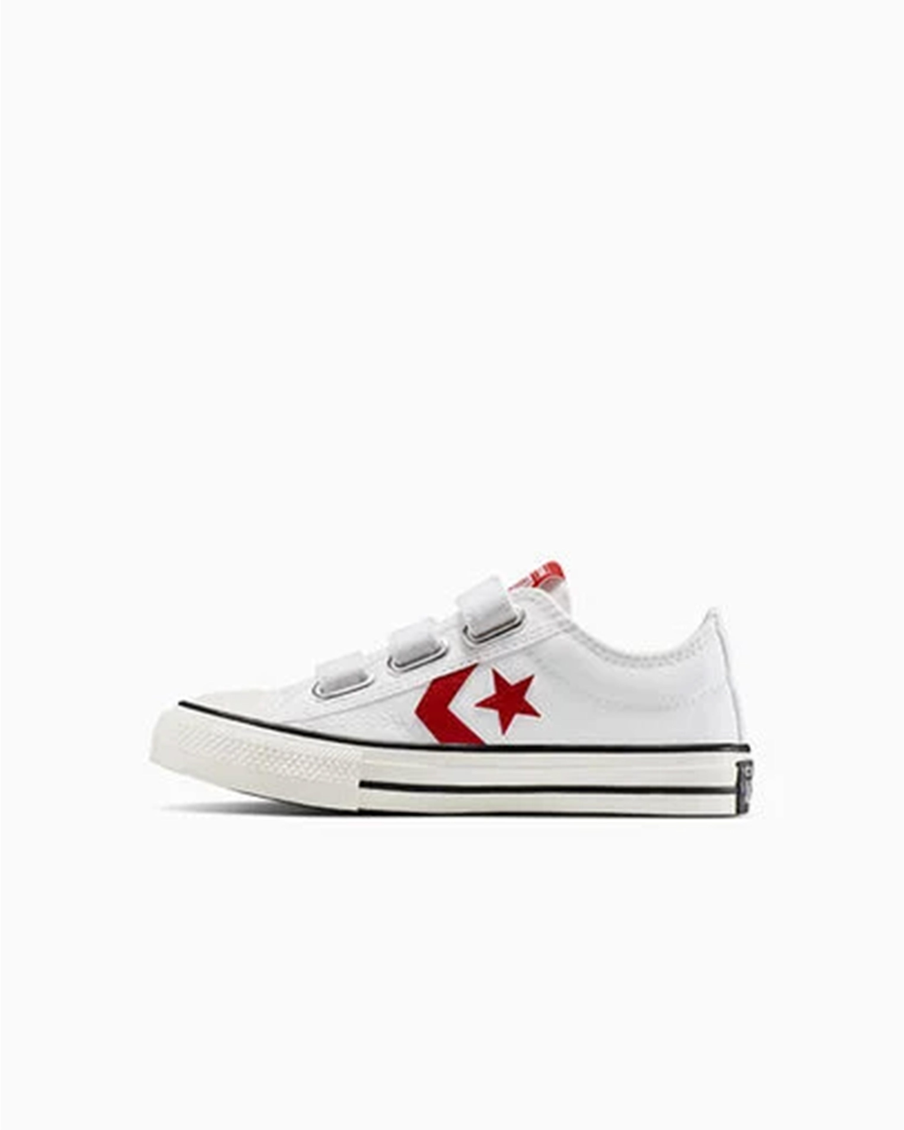 Converse kids' sneakers in white with red details, viewed from the opposite side profile.