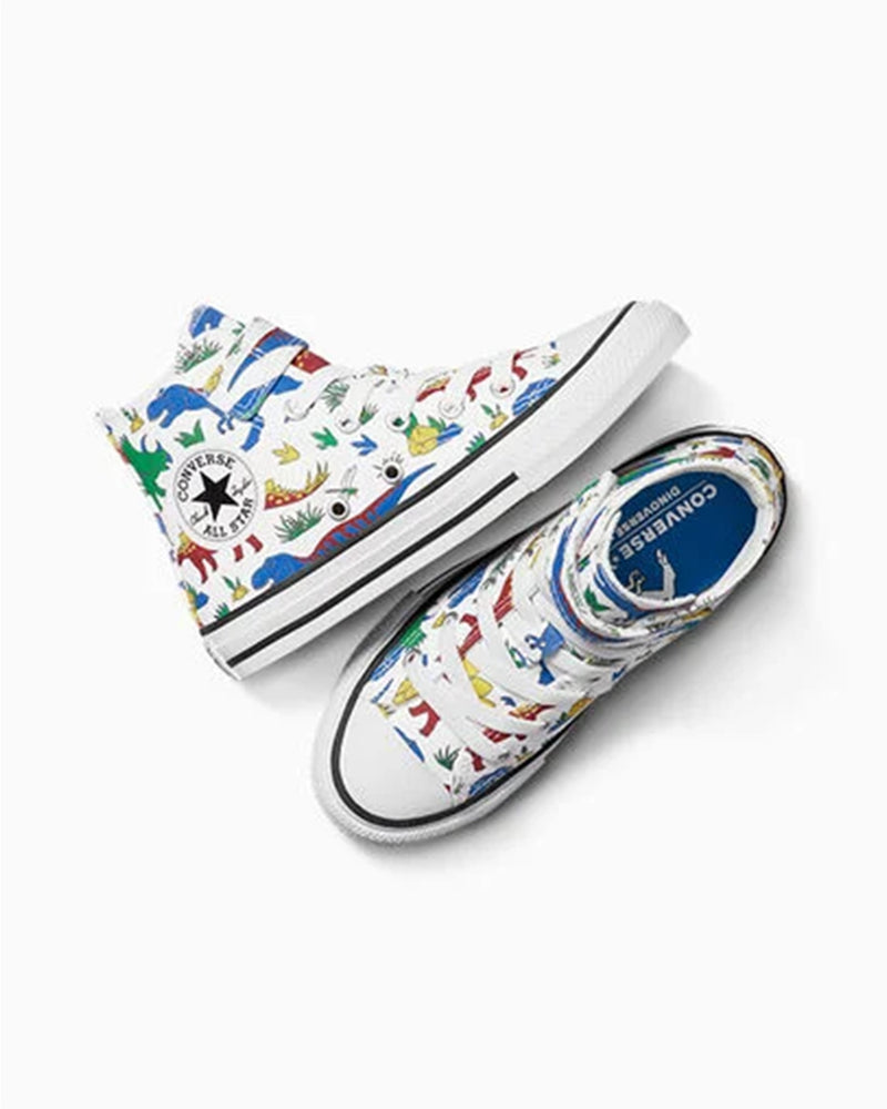 Flat lay of Converse dinosaur print high-tops showing side view and top-down view with blue dinosaur insole.