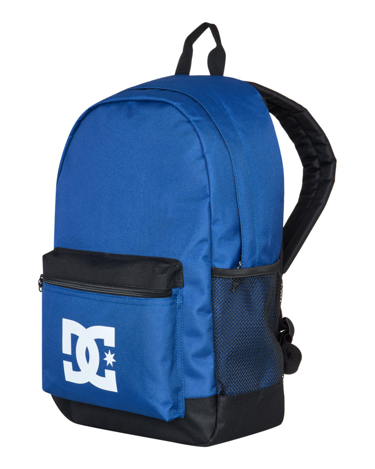 Angled front view of DC backpack with zip front pocket, white logo and mesh side compartment