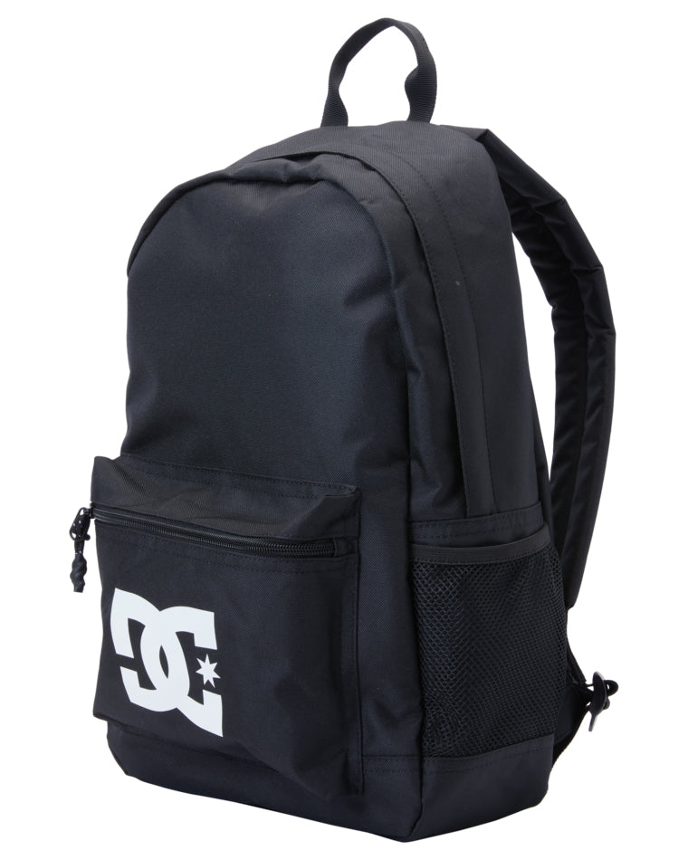 Angled view of DC backpack with front logo pocket and side mesh pouch