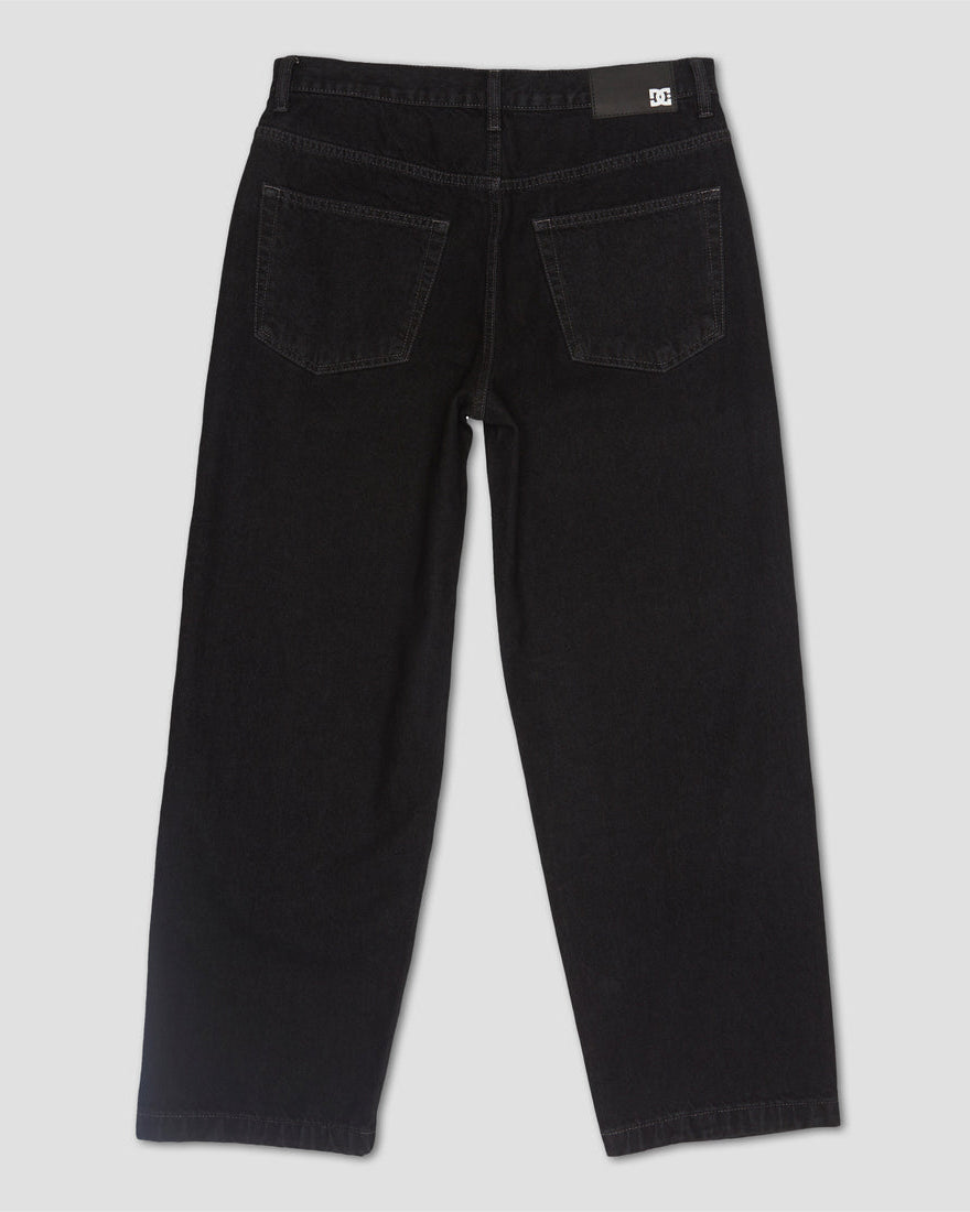Back view of black straight leg jeans with two rear pockets and DC logo patch