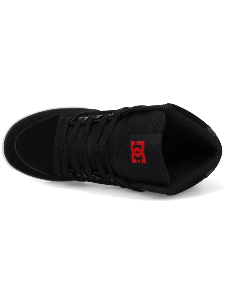 Top view of black DC high-top sneaker showing lace-up front and red tongue branding