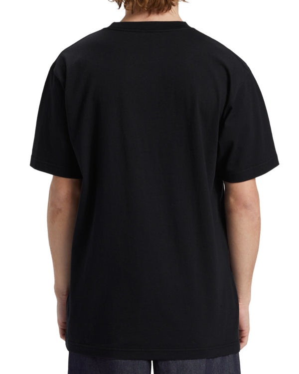 Back view of black DC t-shirt with no graphic, showing plain design and relaxed fit.