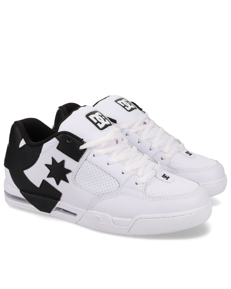 Angled view of white and black DC sneakers with perforated panels and lace-up front