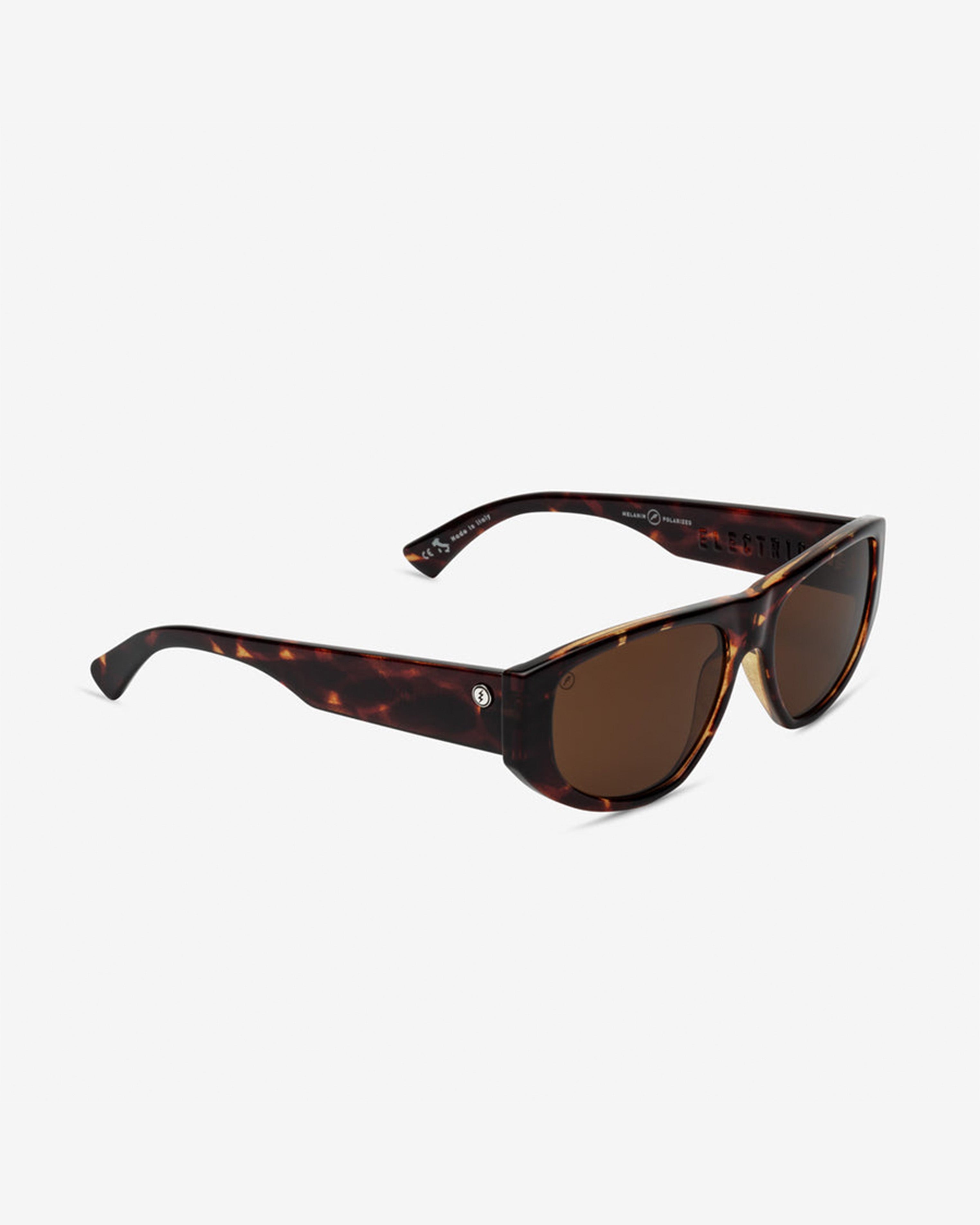 Angled view of tortoiseshell sunglasses with brown lenses and sleek wraparound fit.