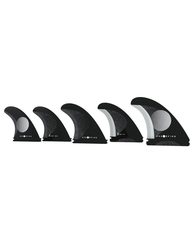 Set of six black surfboard fins with white center on a white background