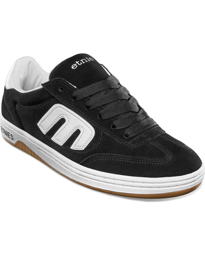 Angled view showing black laces and suede upper.