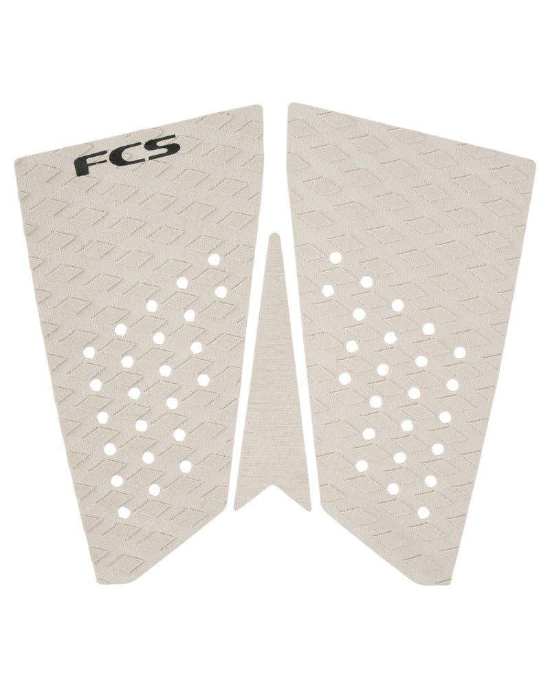White FCS two-piece surfboard tail pad with textured diamond grooves and angled kick tail
