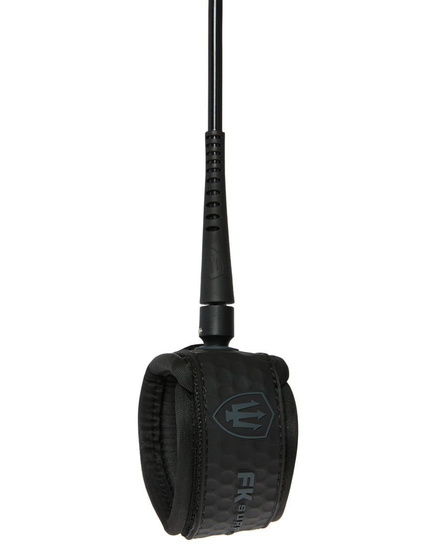 Black FK Surf leash ankle cuff with honeycomb texture, padded lining, and FK logo for secure, all-day surf comfort.
