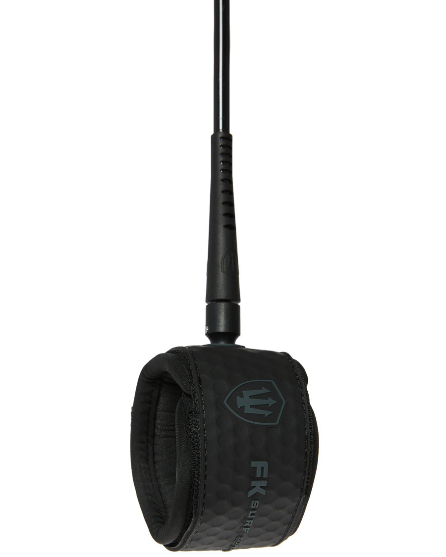 Black FK Surf leash cuff with textured neoprene padding and subtle FK logo, designed for comfort and durability.
