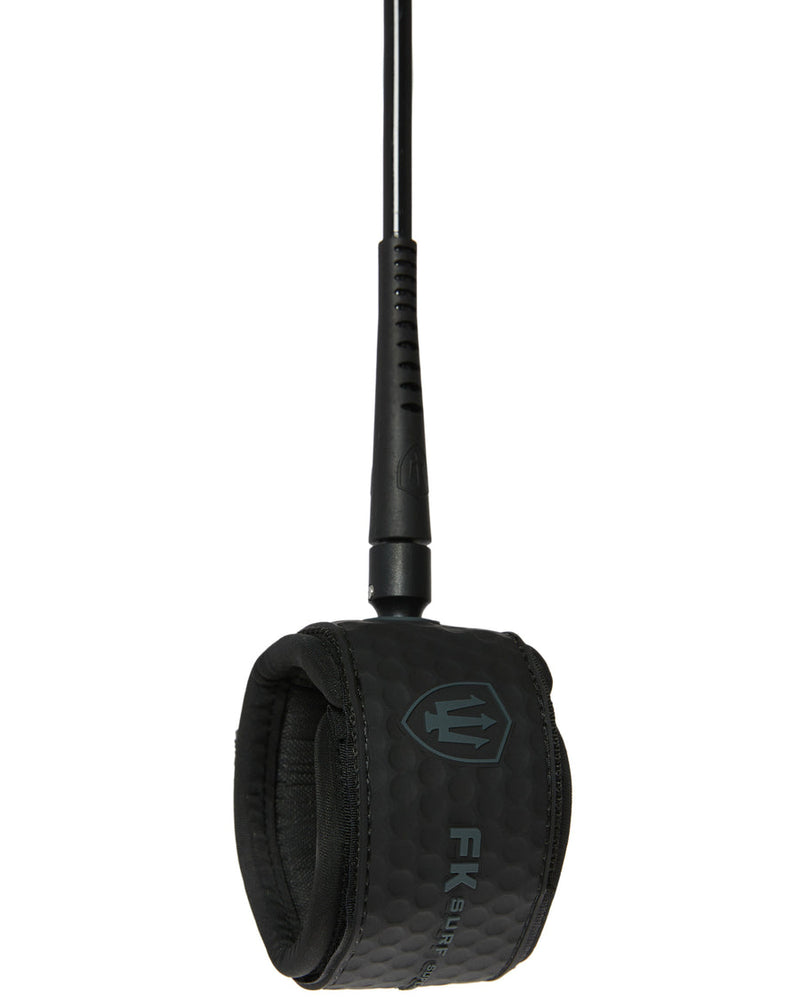 Black surfboard leash with textured padded ankle strap, dark trident logo, and strong black cord for secure surf sessions.
