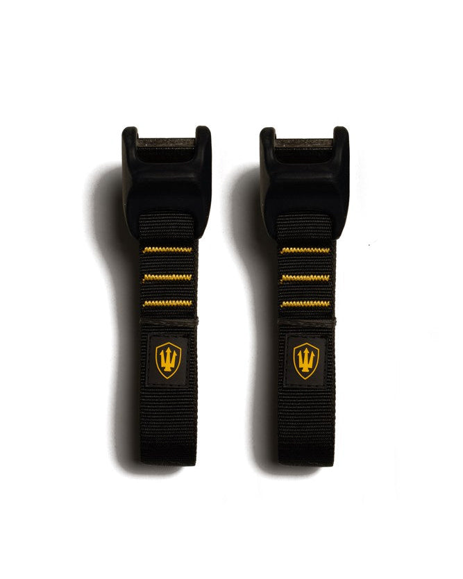 Black tie-down straps with black buckles and yellow stitching, featuring a yellow trident logo on each strap.
