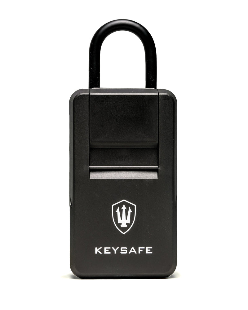 Black KeySafe lock box with protective cover and trident logo for secure key storage.