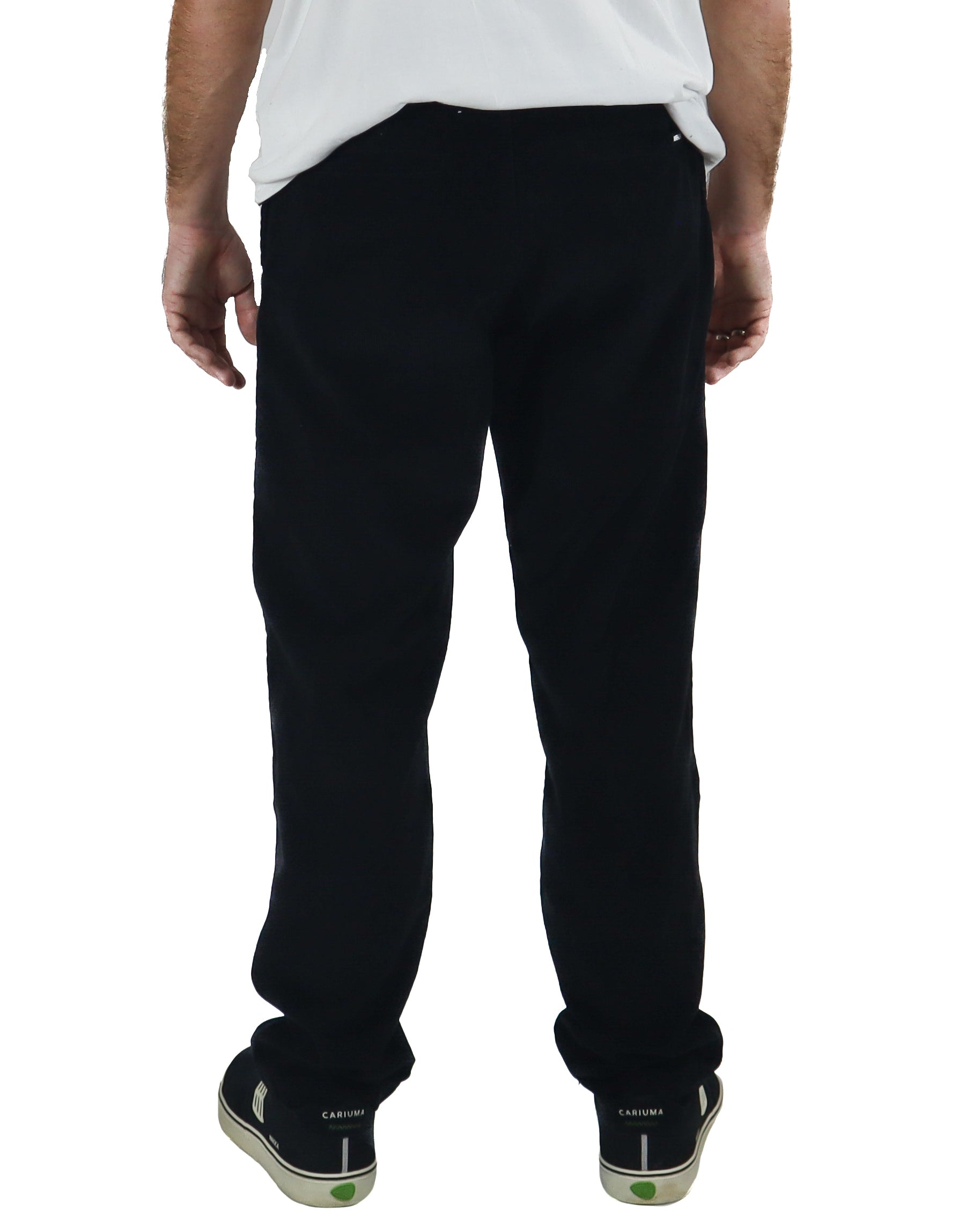 Rear view of black corduroy pants with a mid-rise waist and loose fit