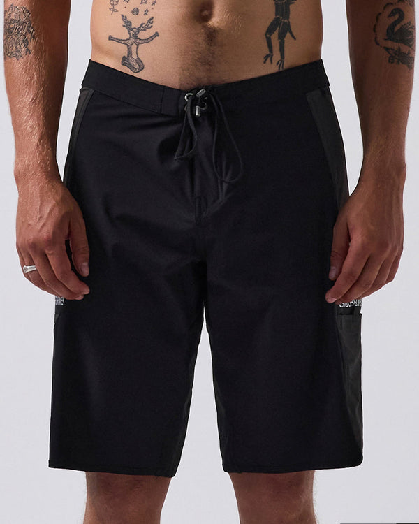 Black boardshorts with a drawstring waist, sleek design, and side pockets, offering a functional and minimalist style.