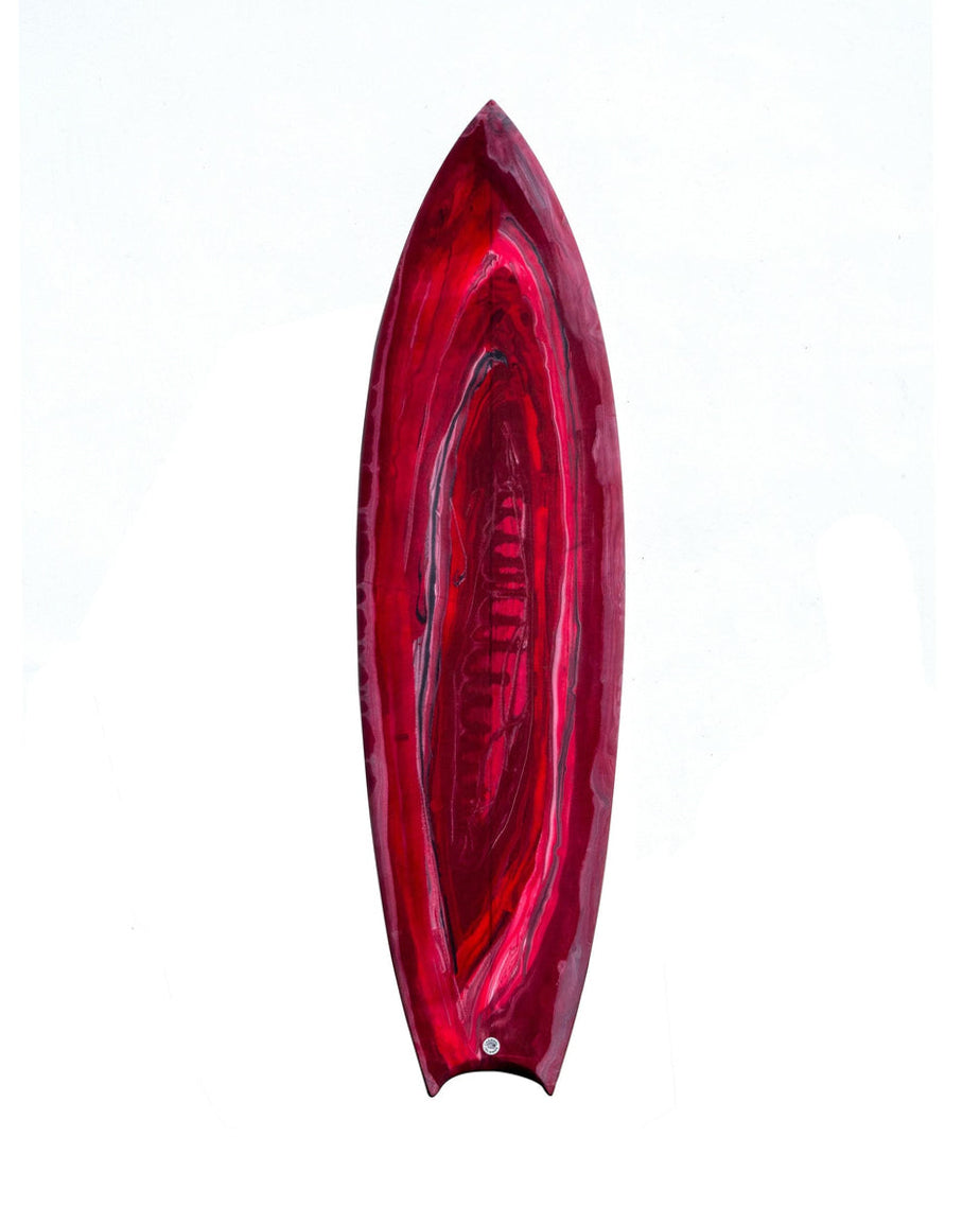 Channel Islands surfboard featuring a red resin tint deck with swirled marbled finish and swallow tail design.