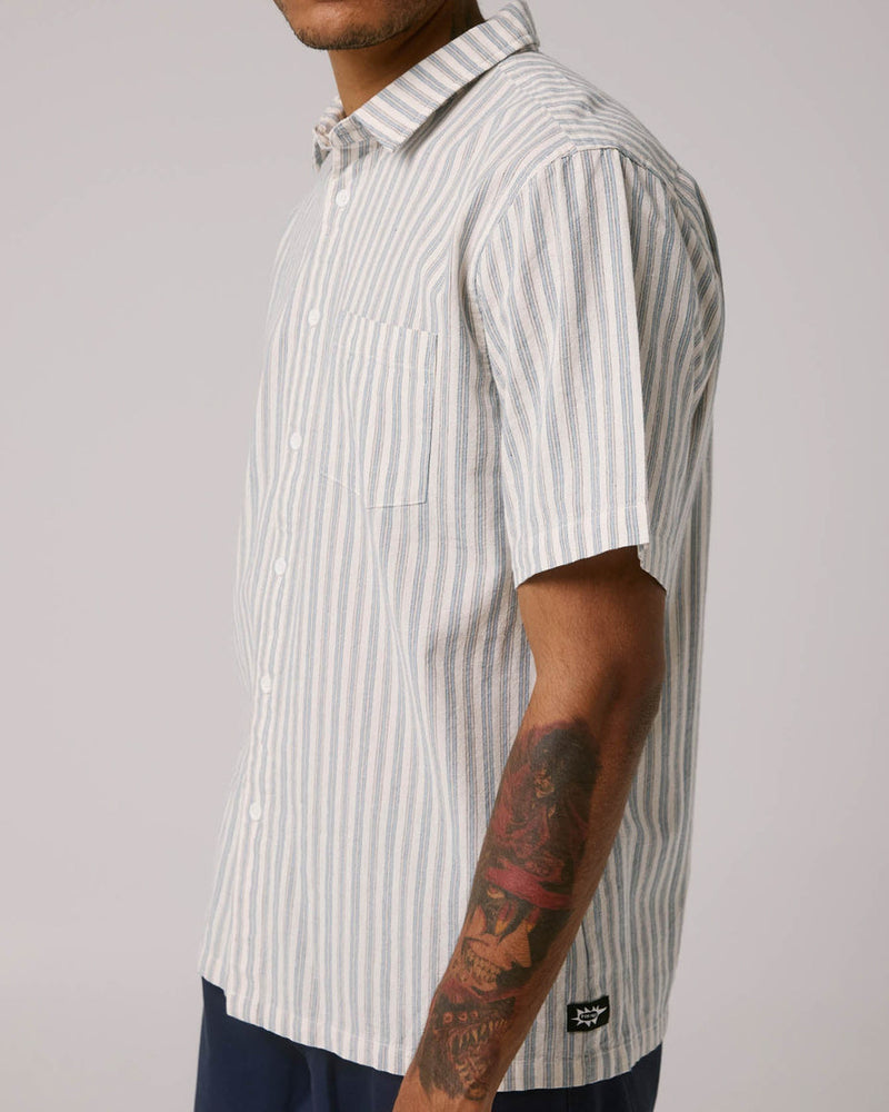 Side view of vertical striped short sleeve shirt with button front and chest pocket