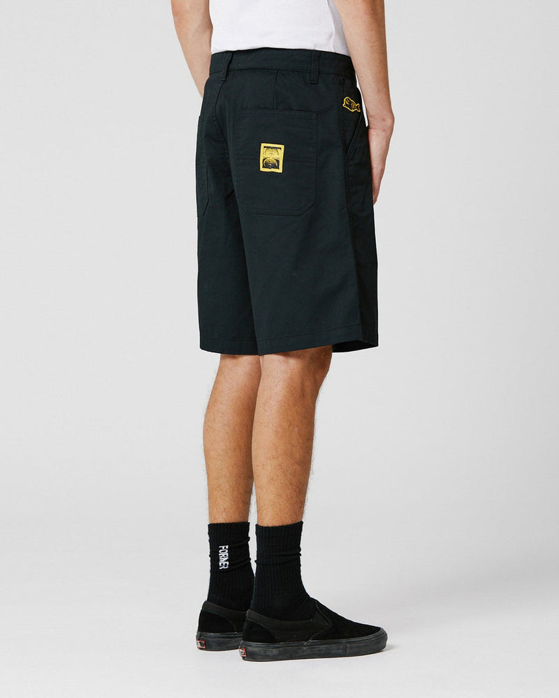 Black work shorts back view with yellow patch label and relaxed fit
