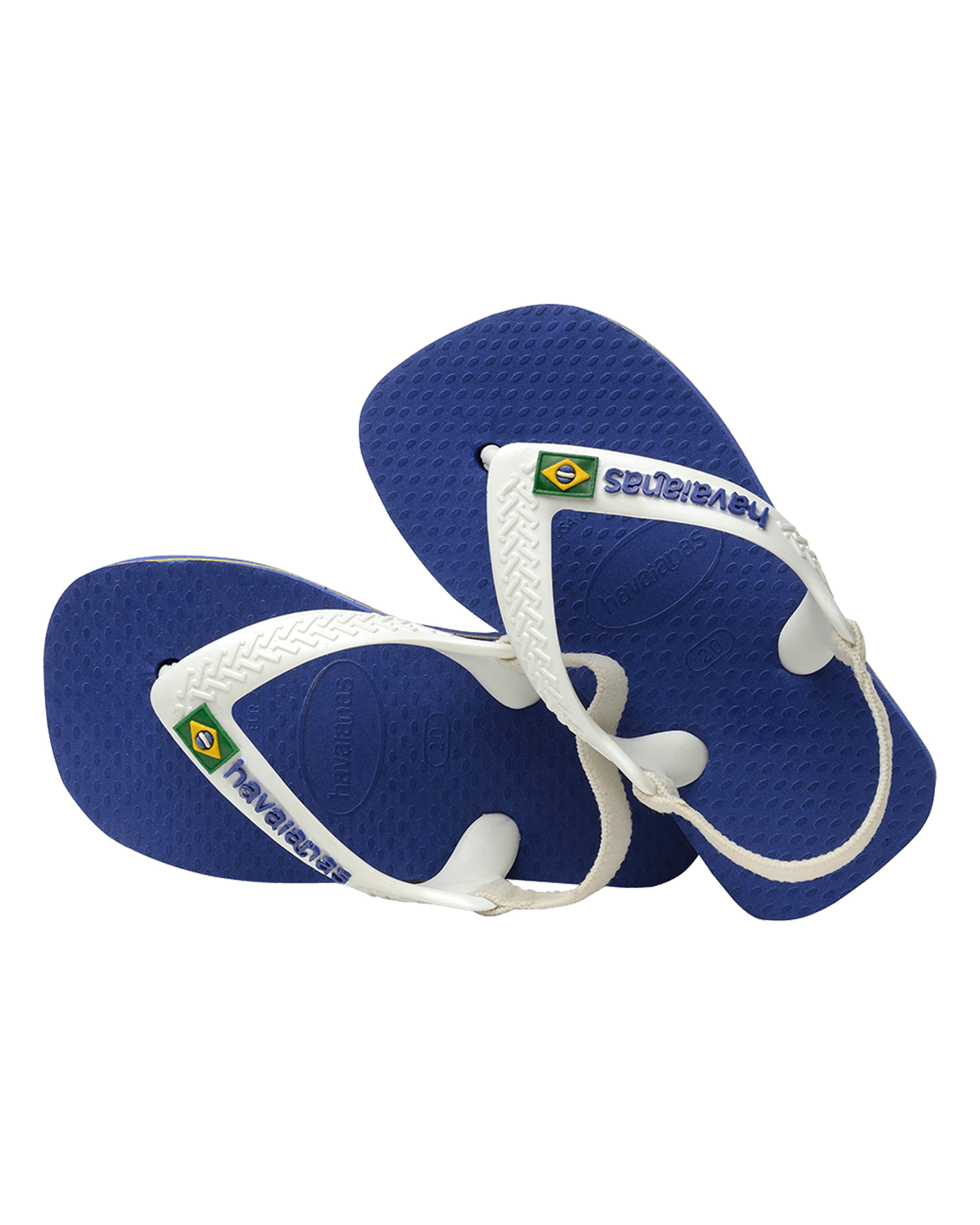 Top angle of blue and white Havaianas baby thongs with textured footbed and logo strap