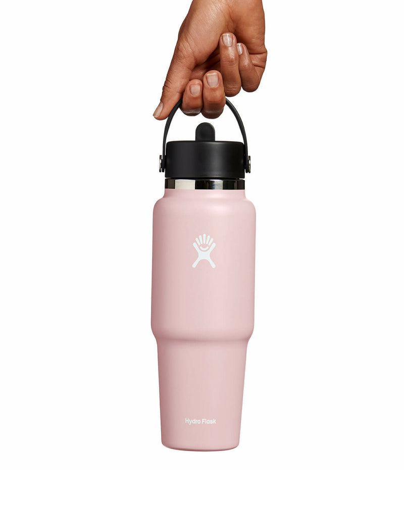 Pink Hydro Flask 946ml being held by flex strap, showing its ergonomic grip and sleek insulated design.