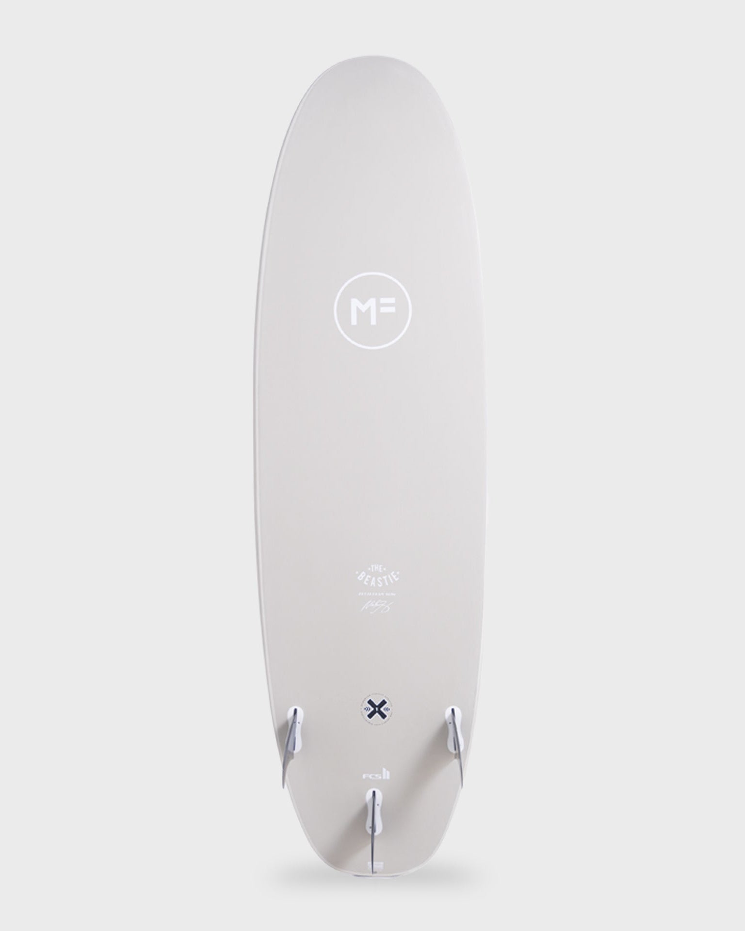 MF Beastie softboard with FCS II fin setup and tail branding, designed for beginner to intermediate surfers.