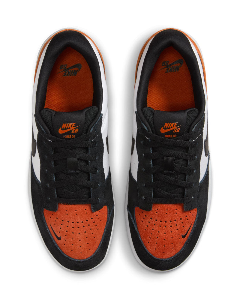 Top view of low-top sneakers featuring black, white, and orange panels, orange insoles with "Nike SB" branding, and black laces.